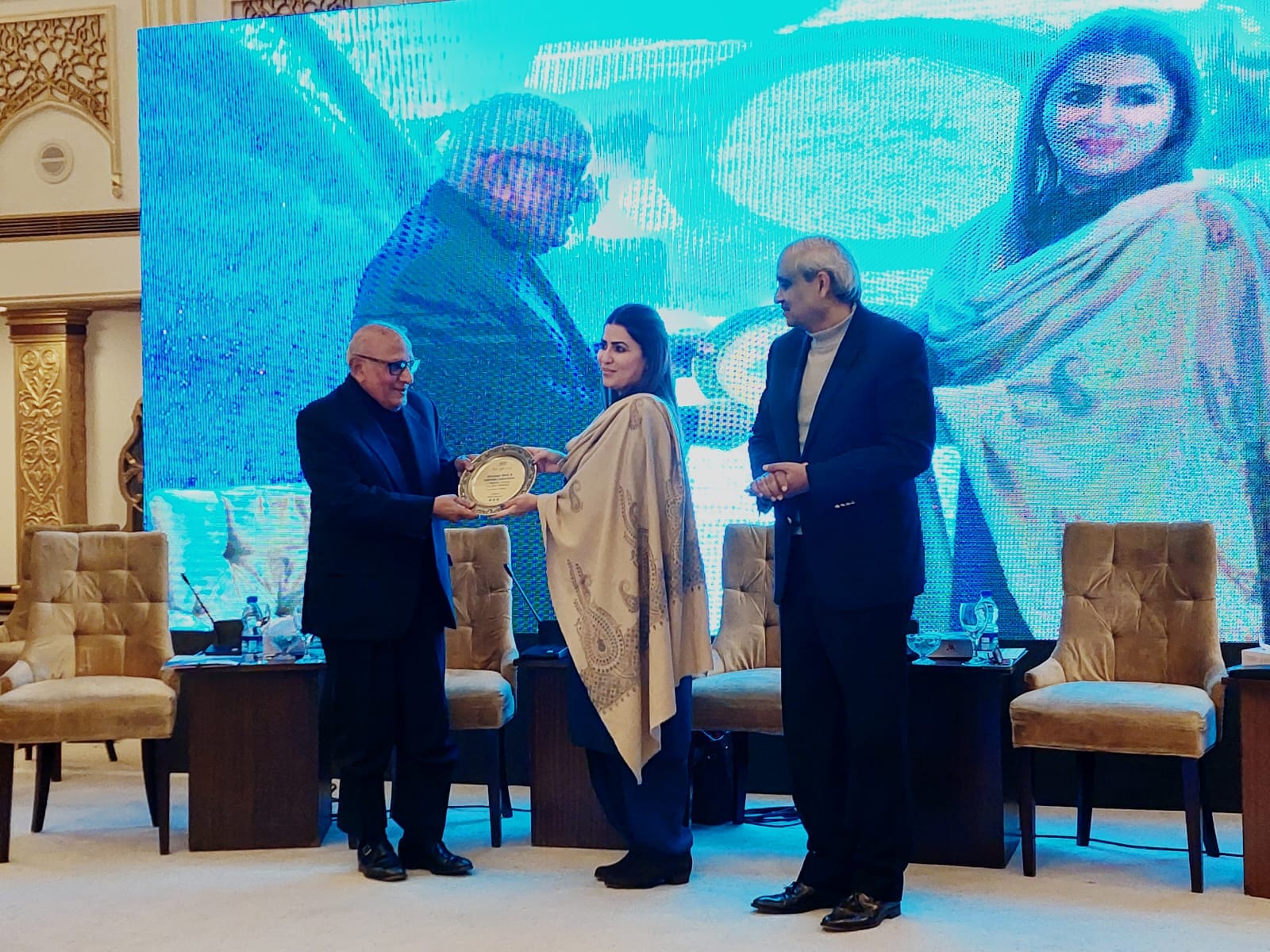 Mr. Shoaib Sultan Khan, Chairman NSRS presenting souvenir to Ms. Shazia Marri, Federal Minister and Chairperson BISP.
